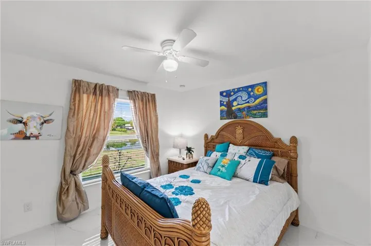Bedroom featuring baseboards and a ceiling fan