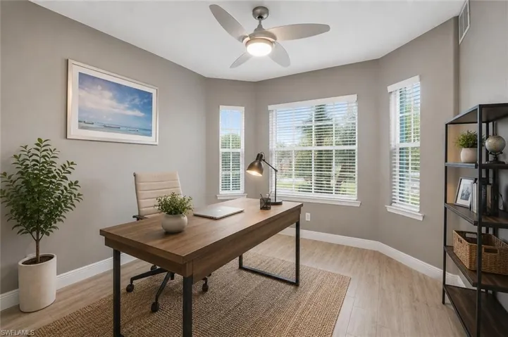 Neutral toned walls complement wood-finish flooring