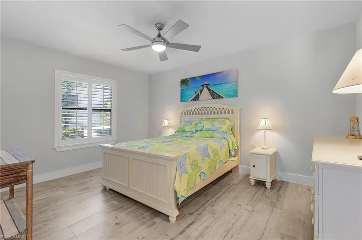 Bedroom featuring ceiling fan and tile flooring