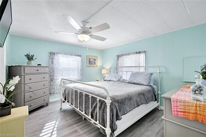 Alternate view of the primary suite highlighting the generous room size and peaceful retreat.