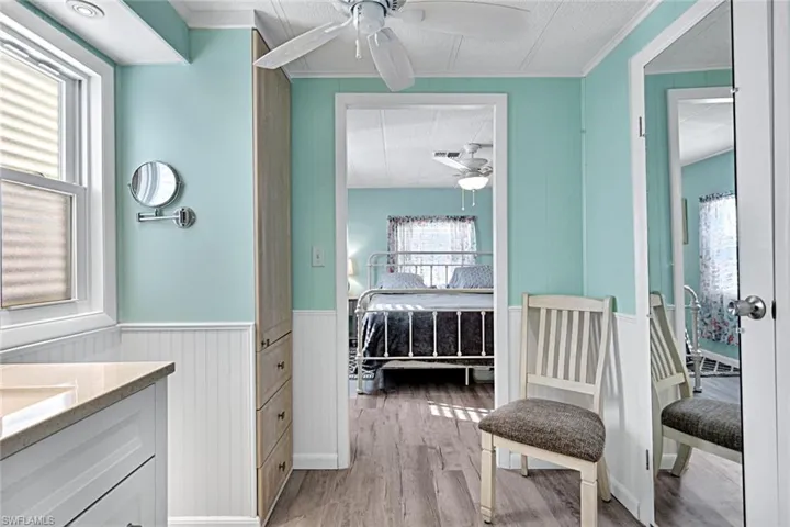 Dressing area with built-in vanity and convenient access to the primary bedroom and bathroom.