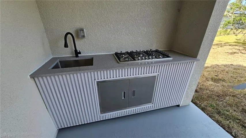 Details with stainless steel gas stovetop and sink