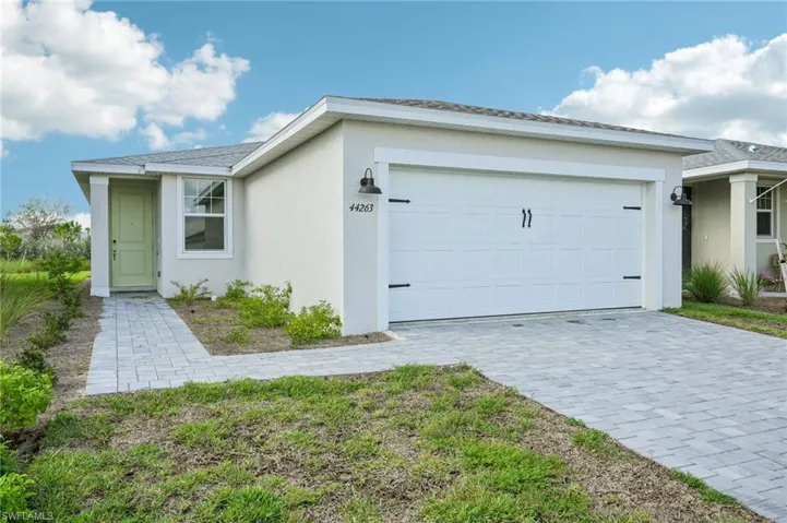 Single story home featuring a garage