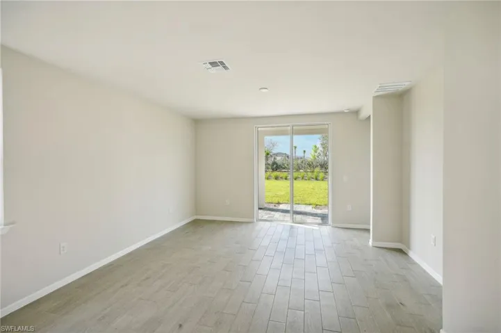 Empty room featuring light hardwood / wood-style flooring