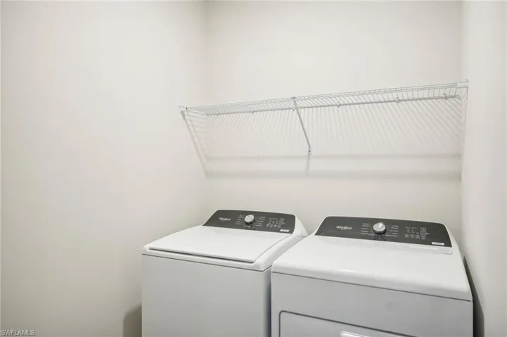 Washroom featuring washer and dryer