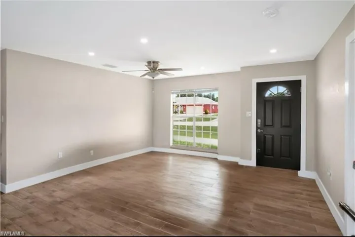 Foyer with recessed lighting, wood finished floors, and a ceiling fan