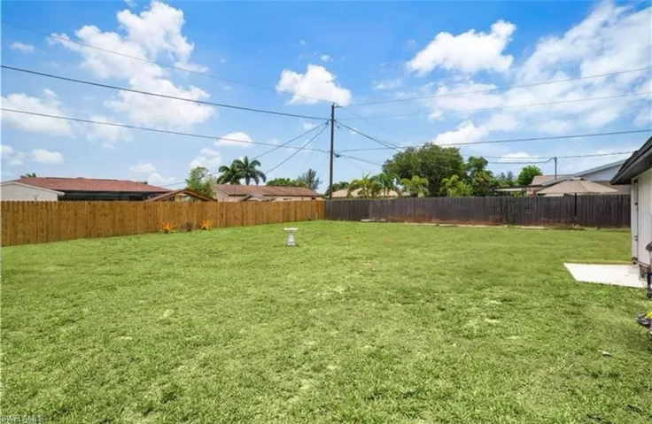 View of fenced backyard