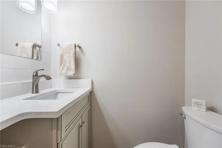 Bathroom with vanity and toilet