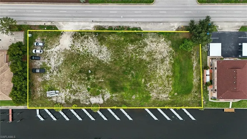 Aerial view of property and surrounding area with property boundaries highlighted