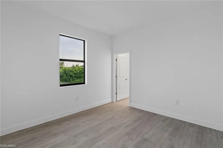 Unfurnished room with light wood-type flooring