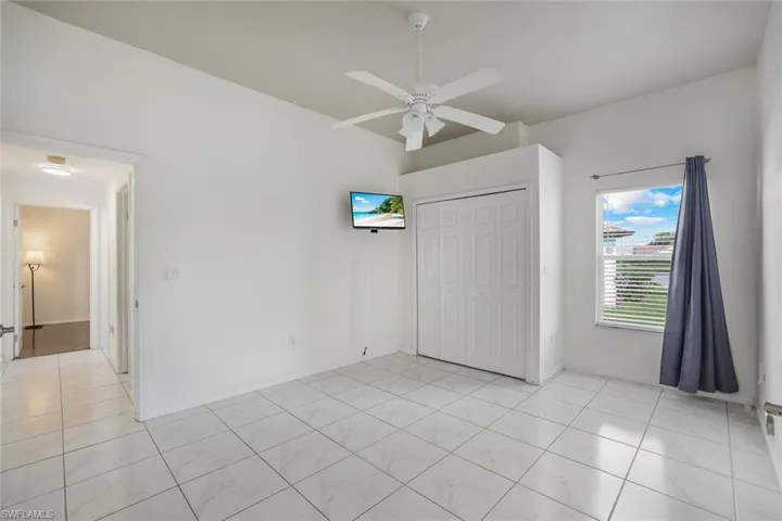 Bedroom with a closet and ceiling fan