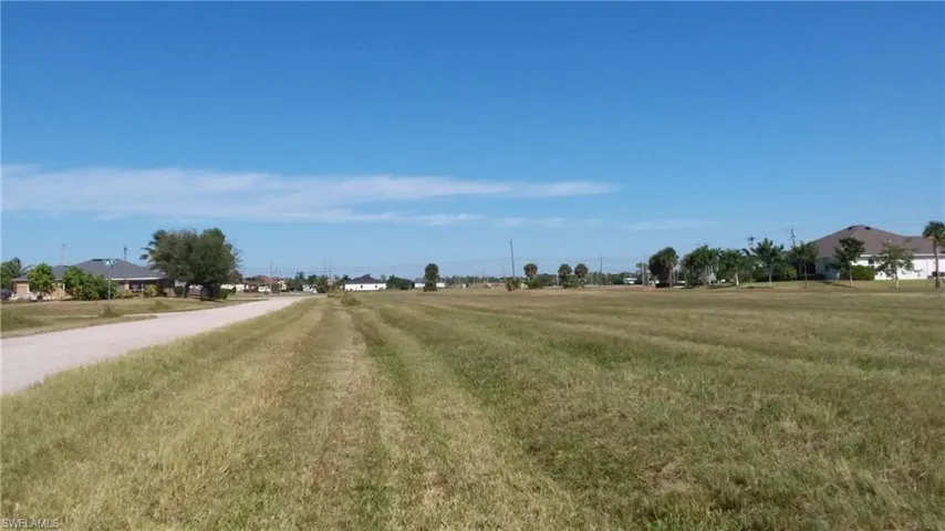 View of asphalt road featuring a rural view