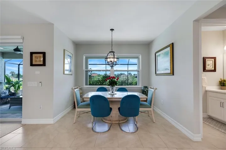 KITCHEN TABLE AREA OVERLOOKING THE POOL