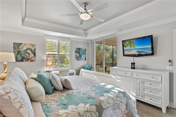 The primary bedroom also features access to the lanai.
