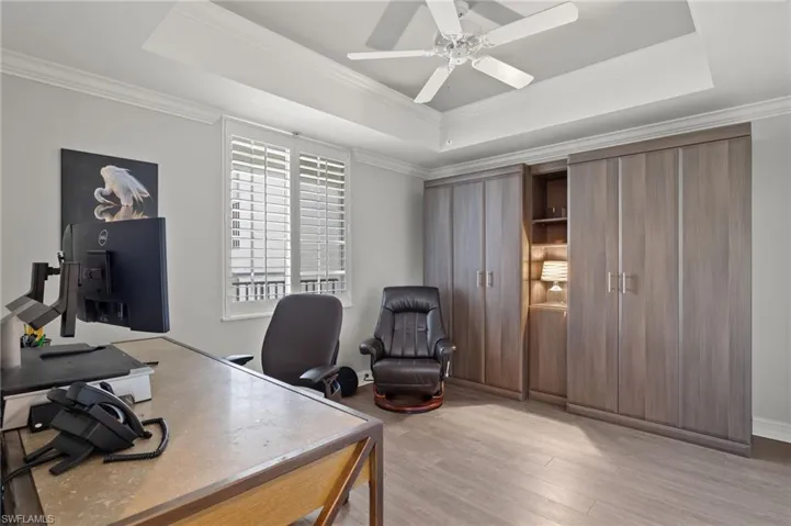 Guest bedroom with custom built twin murphy bed system can also serve as an office.