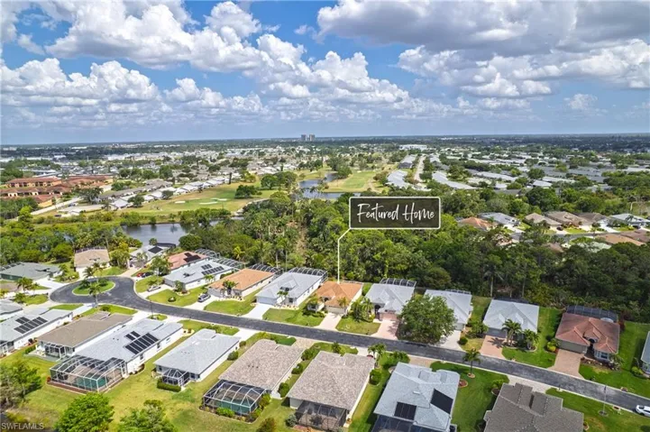 Birds eye view of property featuring a residential view and a water view