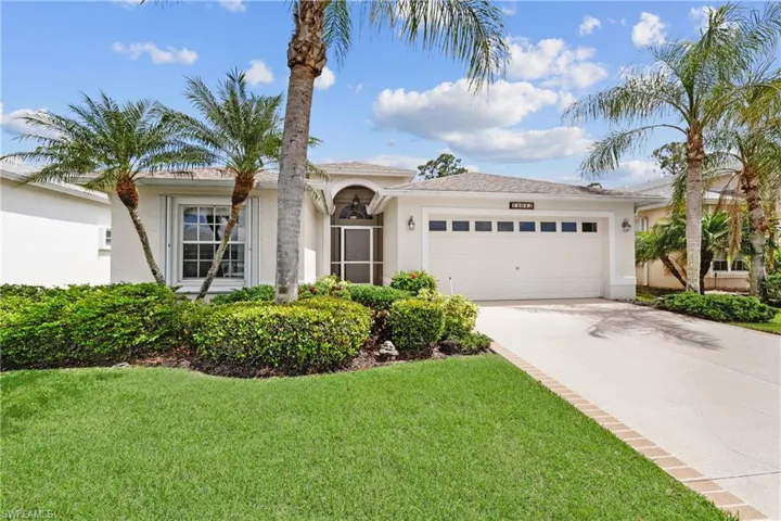 Freshly painted single story home with driveway, stucco siding, and an attached double garage