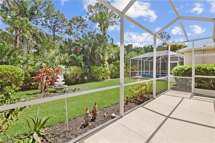 Screened Lanai with views of gorgeous backyard.