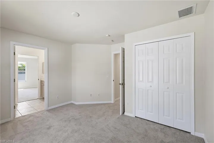 Bedroom 3 next to laundry room and garage