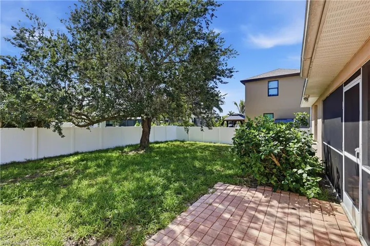 Patio, shade tree and fenced yard.