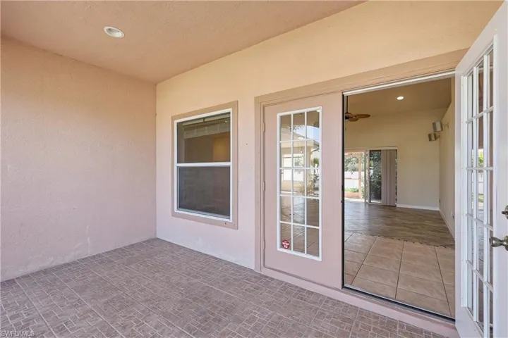 Screened lanai and french entry doors.