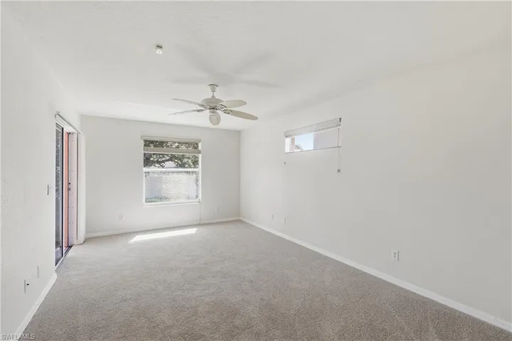 Primary bedroom with slider to rear lanai