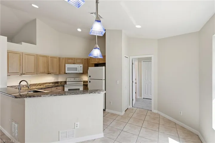 Kitchen with bedroom on the right