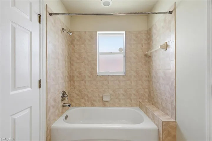 Tiled shower bath between bedrooms 2 and 3