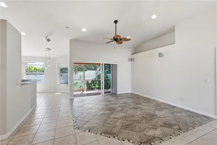 Great room facing the rear lanai and fenced yard