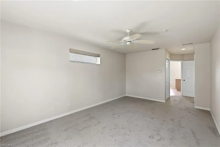 Primary bedroom facing the walk in closet on the left and bathroom