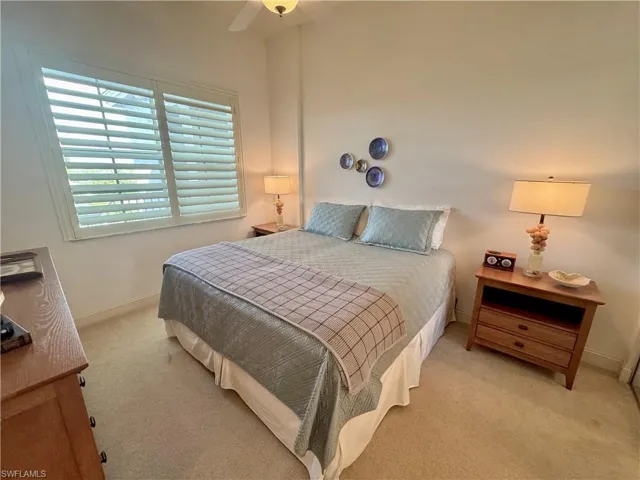 Guest bedroom featuring ceiling fan and connected guest bathroom