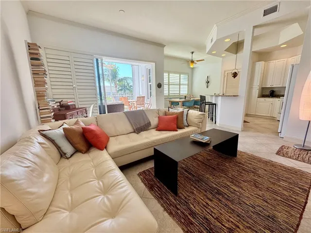 Living room with light tile patterned floors