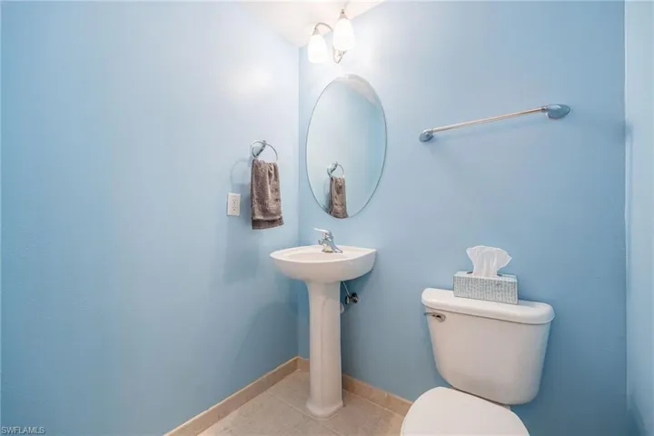 Bathroom with tile patterned flooring and toilet