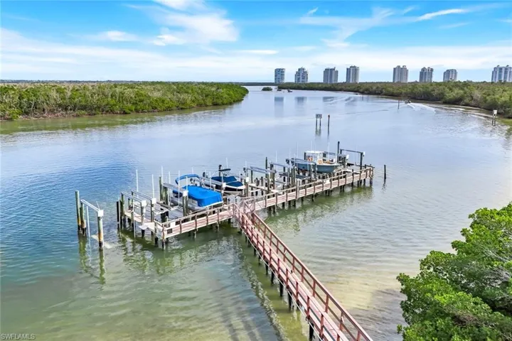 Dock featuring boat lift and a water view