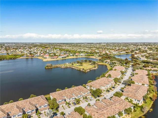Aerial view of residential area featuring a large body of water