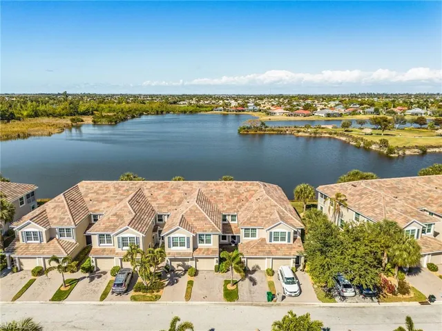 Aerial perspective of suburban area with a large body of water
