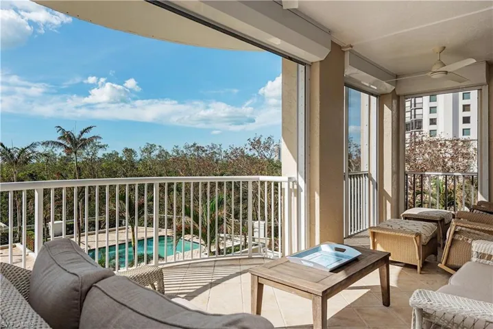 Sunroom featuring ceiling fan
