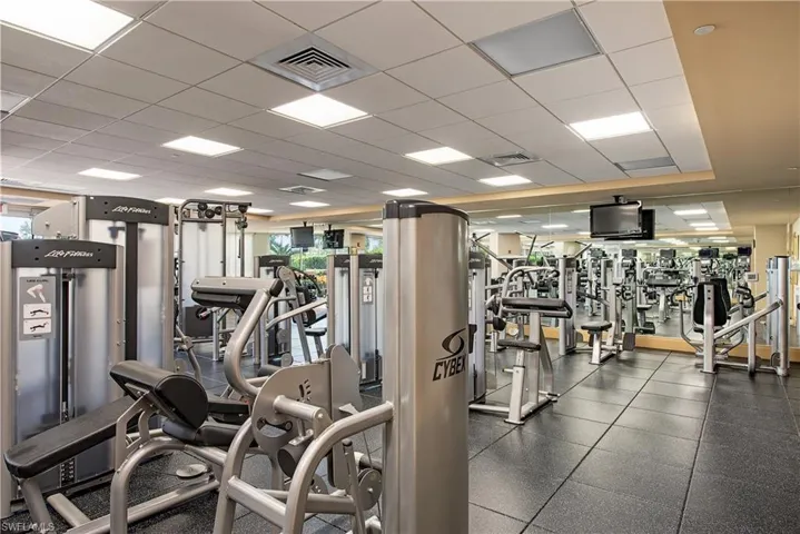 Workout area with a paneled ceiling