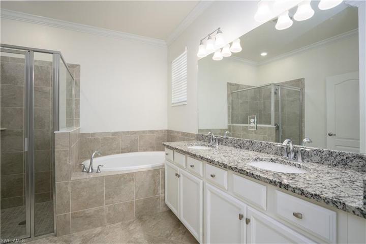 Dual sinks with separate shower and soaking tub