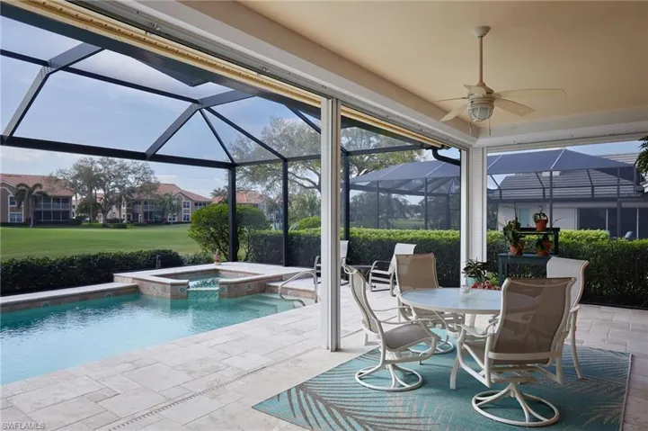 Pool/spa area with panoramic screen, paver tiles and roll-down shutters