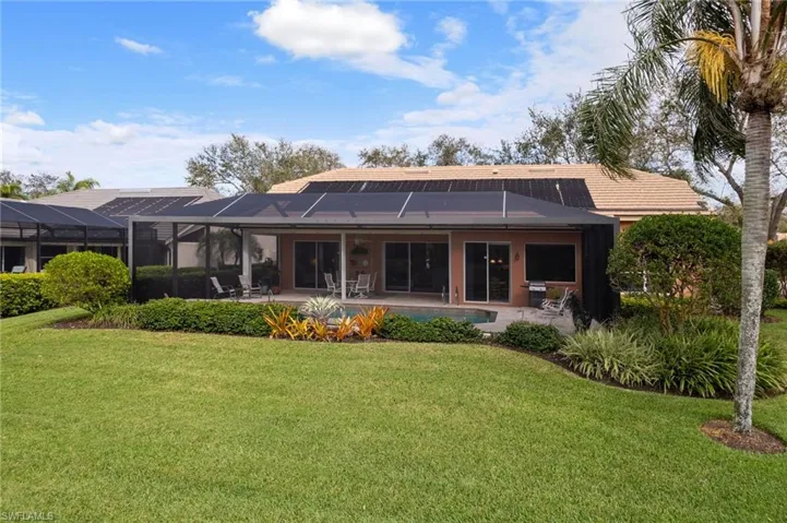 Rear view of house featuring a lanai/pool