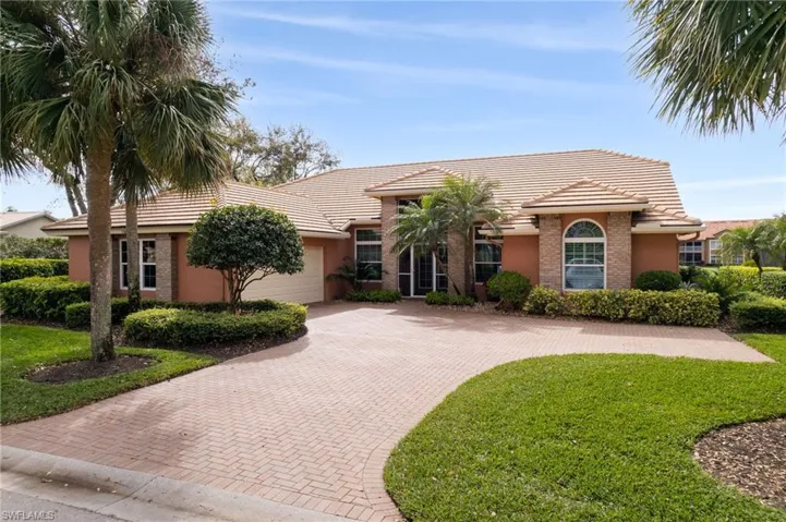 View of front of house with paver driveway