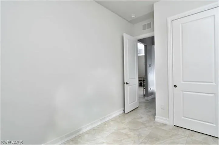 Unfurnished bedroom featuring baseboards