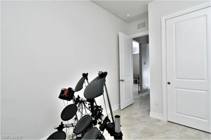 Exercise area featuring baseboards