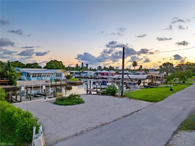 Dock featuring boat lift and a water view