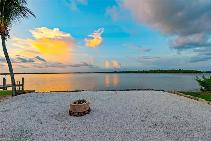 Water view with a fire pit
