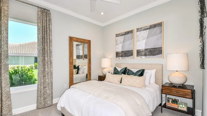 Carpeted bedroom with crown molding, baseboards, a ceiling fan, and recessed lighting