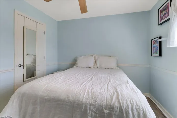 Bedroom with wood finished floors and a ceiling fan