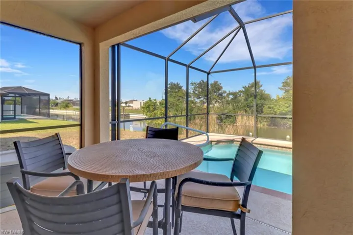 Sunroom featuring a water view