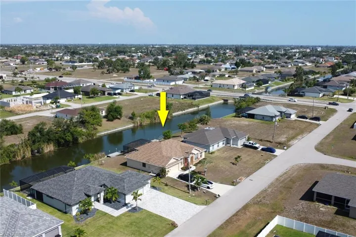 Aerial view of residential area with a nearby body of water